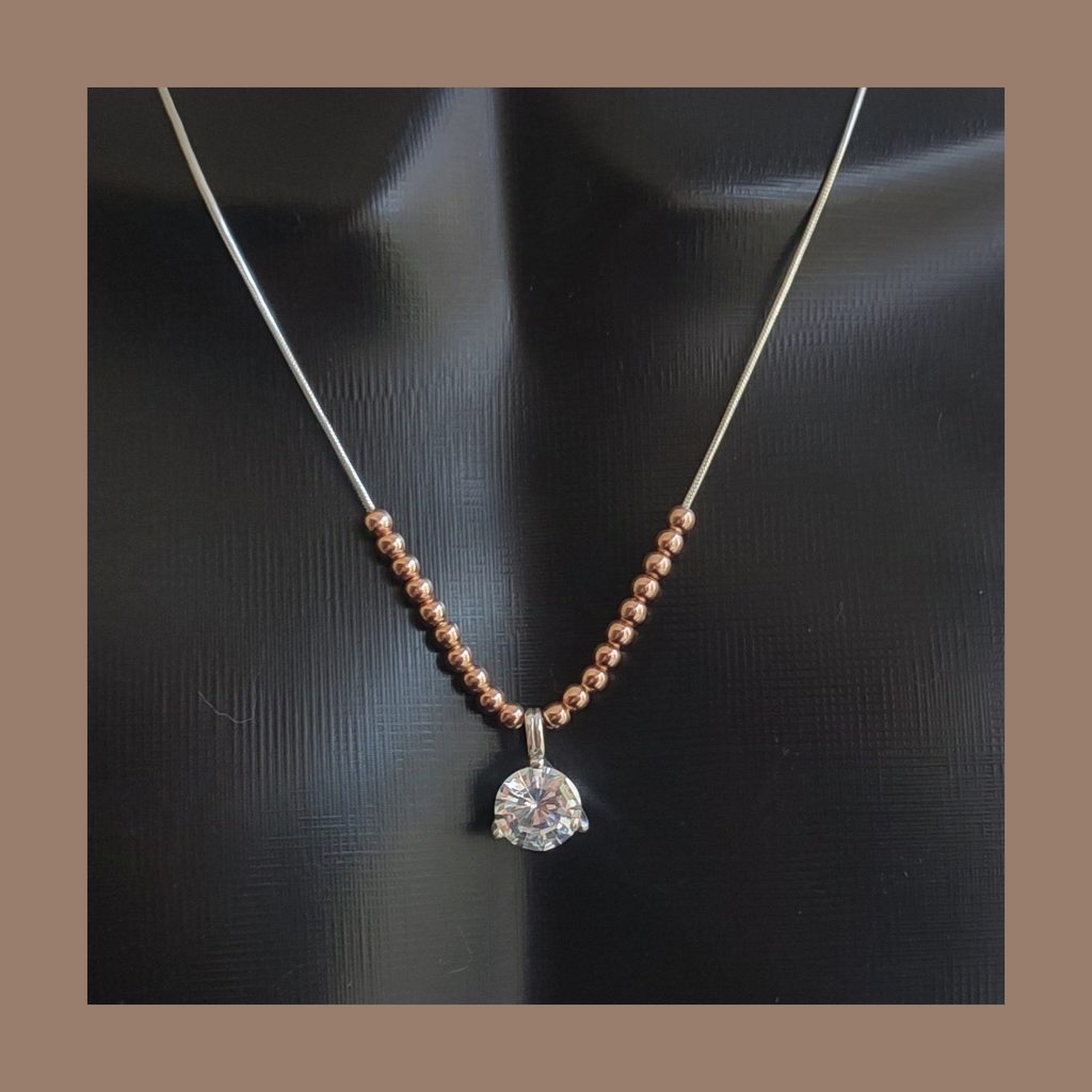 Star Zirconia pendant set in sterling silver and Rose gold plated beads